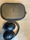 used Bose Quiet-Ear Headphones - Black. Comes with case and charging cord.